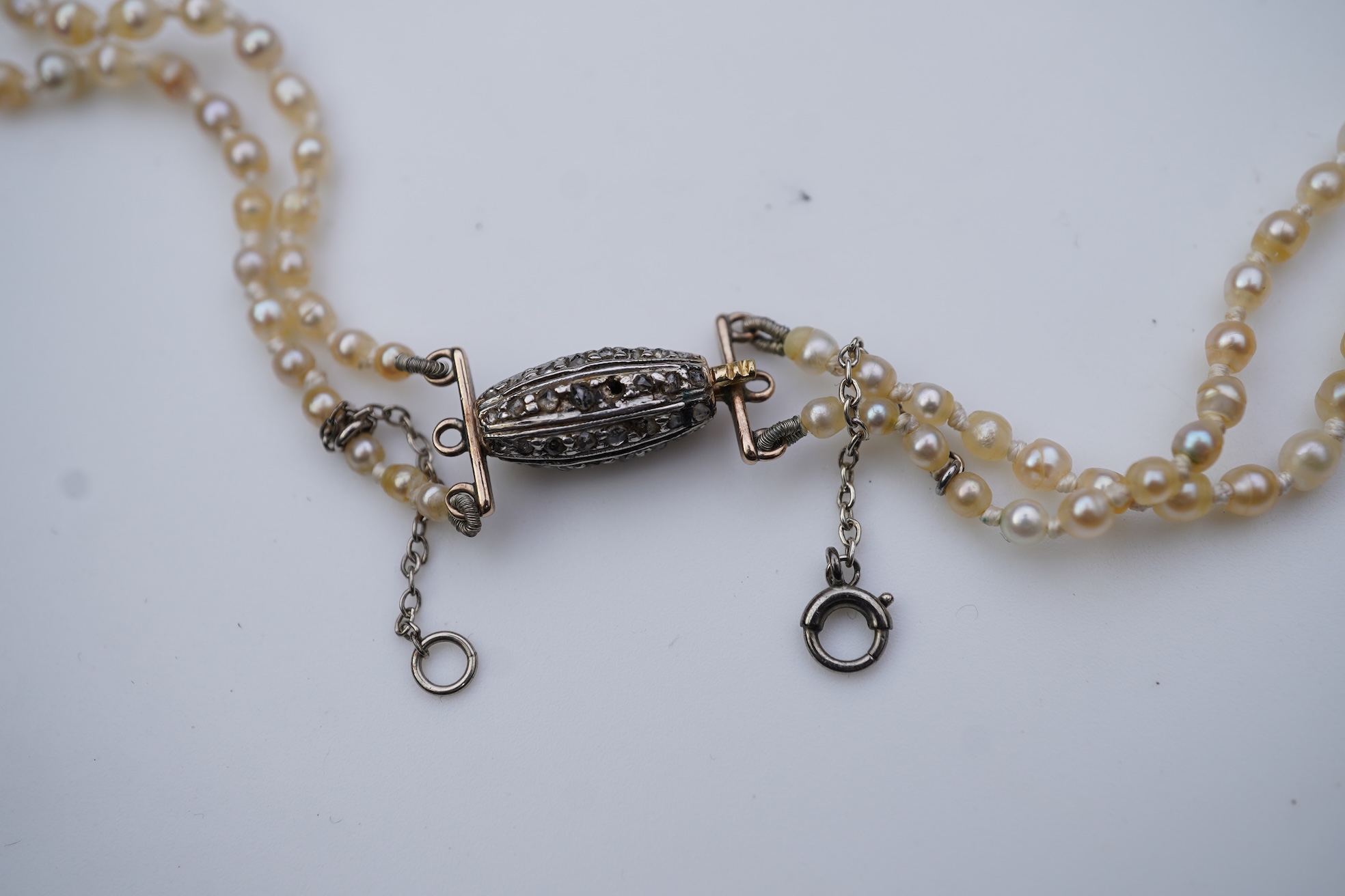 A natural pearl and diamond necklace, early 20th century